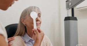 doctor checking visual acuity of a patient doctor checking visual acuity of a patient